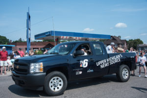 TV6 drove their truck in the parade.