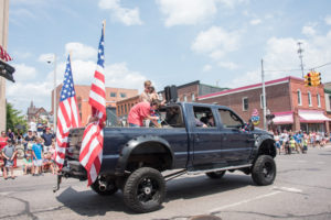 An all around symbol of America - Big trucks and American Flags.