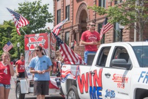 Luke Ghiardi riding in the back of the 2018 Silverado Summer Giveaway Prize truck.
