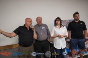 Major Discount, Jim Grundstrom, Jill Grundstrom, and Mike Angeli talking about the giveaway prize.