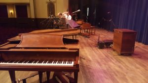 Setting up on the Ishpeming High School Auditorium stage.