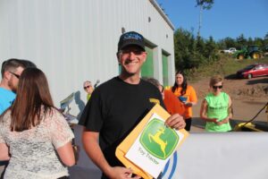 Carl Knofski of Harvey won the John Deere toy tractor!